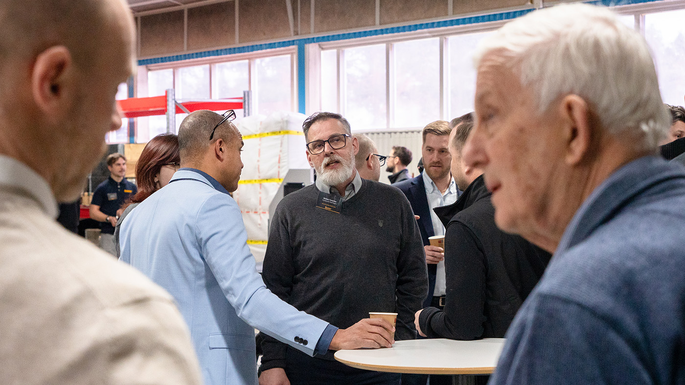 Customers and partners in discussion during Open House